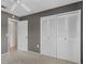 Bedroom has a ceiling fan, neutral carpeting, and a closet with bi-fold doors at 1032 Calanda Ave # 1032, Orlando, FL 32807