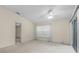 Bright bedroom with a ceiling fan and a large window providing plenty of natural light at 1032 Calanda Ave # 1032, Orlando, FL 32807