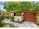 Single-story home features an attached garage, manicured landscaping, and welcoming curb appeal at 1032 Calanda Ave # 1032, Orlando, FL 32807