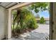 A lush garden view from inside of the garage, bringing the outdoors in at 1032 Calanda Ave # 1032, Orlando, FL 32807