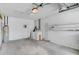 A garage featuring a washer, dryer, water heater, and storage shelves at 1032 Calanda Ave # 1032, Orlando, FL 32807