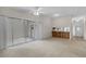 Spacious living room with a large sliding door and a convenient pass-through to the kitchen at 1032 Calanda Ave # 1032, Orlando, FL 32807