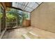A sunroom featuring screens and a partial covering overhead to allow natural light at 1032 Calanda Ave # 1032, Orlando, FL 32807