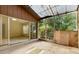 An enclosed lanai/sunroom featuring a wall of screens and sliding glass doors at 1032 Calanda Ave # 1032, Orlando, FL 32807