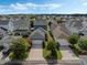 An elevated view of a charming blue home, showcasing its well-kept lawn and inviting curb appeal at 1034 Huntspoint St, Winter Garden, FL 34787