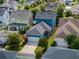 An aerial perspective capturing a charming blue two-story home with a well-kept lawn in a peaceful neighborhood at 1034 Huntspoint St, Winter Garden, FL 34787