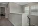 Bright hallway with neutral paint and carpet, offering a transition between rooms and floors at 1034 Huntspoint St, Winter Garden, FL 34787