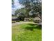 Scenic view of a quiet neighborhood street lined with mature trees and well-maintained lawns at 1034 Villa Ln # 18, Apopka, FL 32712