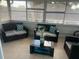 Relaxing Florida room with comfortable seating, neutral furniture, and a view of the lush surroundings at 1034 Villa Ln # 18, Apopka, FL 32712