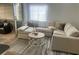 Open living room with a large sofa, stylish rug, and inviting ambiance for relaxation and entertainment at 1034 Villa Ln # 18, Apopka, FL 32712