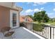 Outdoor balcony offering clear views of neighborhood, white tile, and wrought iron at 10915 Emerald Chase Dr, Orlando, FL 32836
