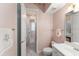Bathroom featuring modern fixtures, tile flooring, and an adjoining room with chandelier at 10915 Emerald Chase Dr, Orlando, FL 32836