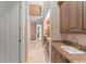 The large en-suite bathroom features tile floors, double sinks, and access to a shower and walk-in closet at 10915 Emerald Chase Dr, Orlando, FL 32836