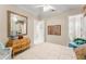 Cozy bedroom features white-painted walls, natural light from the large windows, and a vanity at 10915 Emerald Chase Dr, Orlando, FL 32836