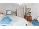 Charming bedroom showcasing a four-poster bed and lots of natural light at 10915 Emerald Chase Dr, Orlando, FL 32836