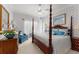 Elegant bedroom featuring a four-poster bed, and custom wallpaper at 10915 Emerald Chase Dr, Orlando, FL 32836