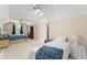 Spacious bedroom with plush carpeting, ceiling fans, and ample natural light from large windows at 10915 Emerald Chase Dr, Orlando, FL 32836