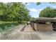 Exterior of covered boat dock with a boat lift and waterfront access, blending convenience with nature at 10915 Emerald Chase Dr, Orlando, FL 32836