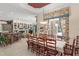 Charming dining area with a large window, a long table, and easy access to kitchen at 10915 Emerald Chase Dr, Orlando, FL 32836