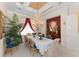 Formal dining room showcasing a grand chandelier, stylish decor, and elegant furnishings at 10915 Emerald Chase Dr, Orlando, FL 32836