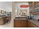 Gourmet kitchen featuring granite countertops, a breakfast bar, and modern appliances at 10915 Emerald Chase Dr, Orlando, FL 32836