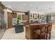 Gourmet kitchen featuring custom cabinetry, granite countertops, and modern appliances at 10915 Emerald Chase Dr, Orlando, FL 32836