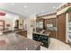Spacious kitchen with granite countertops, stainless steel appliances, and dark wood cabinets at 10915 Emerald Chase Dr, Orlando, FL 32836