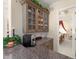Convenient coffee bar with granite countertops and glass-front cabinets, leading to the dining room at 10915 Emerald Chase Dr, Orlando, FL 32836