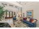 Elegant living room with soaring ceilings, tile floors, and luxurious furnishings at 10915 Emerald Chase Dr, Orlando, FL 32836