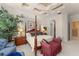 This large main bedroom features a canopy bed, tray ceiling, and access to the en-suite bathroom at 10915 Emerald Chase Dr, Orlando, FL 32836