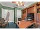 The executive home office features custom built-ins, a large desk, and a staircase view at 10915 Emerald Chase Dr, Orlando, FL 32836