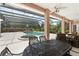 Enclosed pool and patio area with pool, spa, covered outdoor dining, and outdoor furniture at 10915 Emerald Chase Dr, Orlando, FL 32836