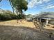 Large backyard with retaining wall, trampoline and covered patio, perfect for outdoor activities and relaxation at 1140 Odoniel S Loop, Lakeland, FL 33809