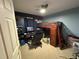 This cozy bedroom includes blue walls, a ceiling fan, and a loft bed at 1140 Odoniel S Loop, Lakeland, FL 33809