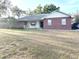 Charming single-story brick home with a welcoming front porch and well-maintained lawn at 1140 Odoniel S Loop, Lakeland, FL 33809