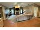 Inviting living room with a fireplace, comfortable seating, and natural light from the windows at 1140 Odoniel S Loop, Lakeland, FL 33809