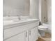 Bright bathroom featuring a white vanity with a modern faucet and a shower-tub combo at 13658 Hidden Forest Cir, Orlando, FL 32828