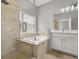 Elegant bathroom showcasing a soaking tub, separate shower, and dual vanity at 13658 Hidden Forest Cir, Orlando, FL 32828