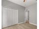 Bright bedroom features a ceiling fan and laminate floors at 13658 Hidden Forest Cir, Orlando, FL 32828