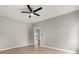 Light-filled bedroom features a ceiling fan and an open doorway at 13658 Hidden Forest Cir, Orlando, FL 32828