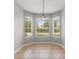 Bright breakfast nook featuring tile flooring and several windows with an outdoor view at 13658 Hidden Forest Cir, Orlando, FL 32828
