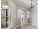 Open dining room with hardwood floors, chandelier, and views of the kitchen at 13658 Hidden Forest Cir, Orlando, FL 32828