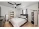 Bedroom with ceiling fan, streamlined furniture, and neutral tones at 14301 Bending Branch Ct, Orlando, FL 32824