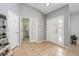Open foyer with tile floors and natural light; bedroom visible through door at 14301 Bending Branch Ct, Orlando, FL 32824