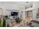Comfortable living room featuring a modern entertainment center and plush seating with neutral tones at 14301 Bending Branch Ct, Orlando, FL 32824