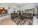 Inviting living room with dual reclining couches, high ceilings, bar seating, and lots of natural light at 14301 Bending Branch Ct, Orlando, FL 32824