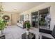 Enclosed patio with tile flooring and sliding glass doors; perfect for relaxation at 14301 Bending Branch Ct, Orlando, FL 32824