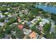 Aerial view of a residential neighborhood near a lake, with mature trees and diverse single-Gathering homes, some with private pools at 1481 Glastonberry Rd, Maitland, FL 32751