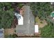Birds-eye view of the home with mature trees, and the surrounding neighborhood at 1481 Glastonberry Rd, Maitland, FL 32751