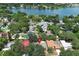 Aerial view showcases the home's location within a neighborhood near a lake at 1481 Glastonberry Rd, Maitland, FL 32751